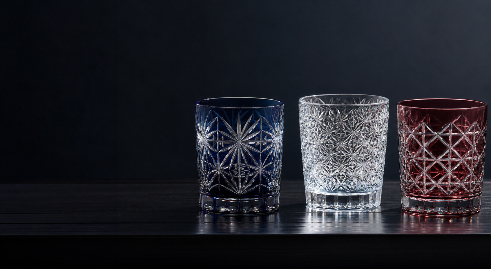 Engraved glass tumblers showing geometric facets and color overlay